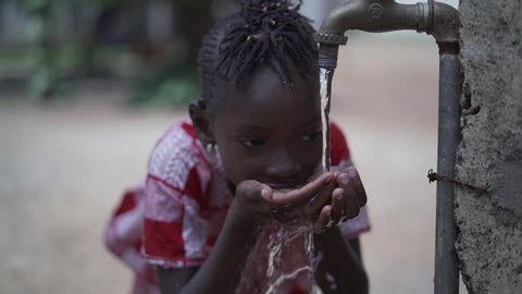 Close up Slow Motion of African Black Girl Drinking Safe Water from Tap