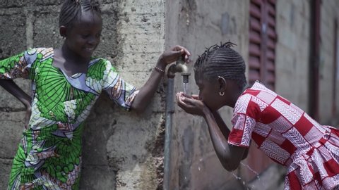 Human Rights Issues, Black Girls Drinking Fresh Water from tap