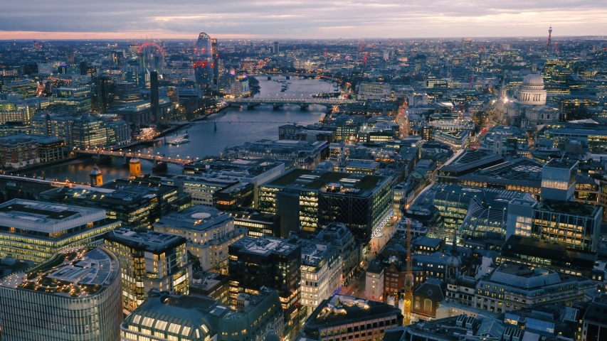 Aerial view of London skyline at dusk. This view looking down the River Thames includes St Paul