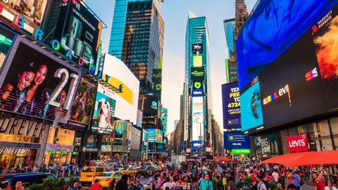 Times Square New York City Sunset Timelapse. High dynamic range 4K super fine timelapse by raw photo files. Crazy busy people, traffic and LED walls of advertisements. New York, USA. 