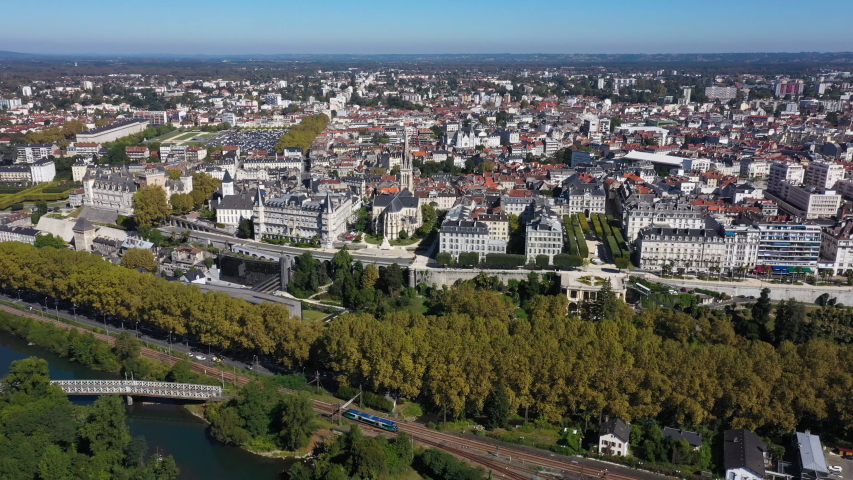 Beautiful aerial view of Pau France train passing along the Gave river 