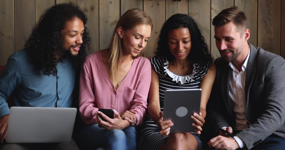 Happy multiracial young friends making group online conference video call together waving hands having fun doing social media app chat using tablet computer, people and digital communication concept Royalty-Free Stock Footage #1037298335