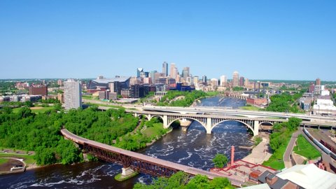 Minneapolis Skyline Over the River on Sunny Day, Aerial Drone 4K