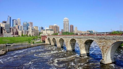 Minneapolis, Minnesota / USA - June 9, 2019: Minneapolis Minnesota Skyline & Bridge, City Aerial Drone 4K