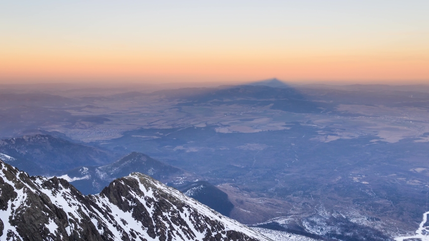 Shadow of Lomnicky Peak during sun set. Royalty-Free Stock Footage #1037310272