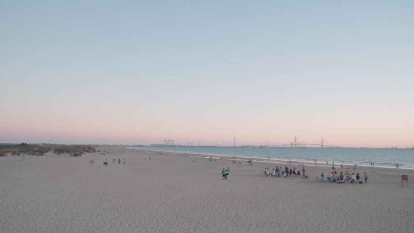 Pink Sunset on White Sand Beach in Cadiz, Spain, Extra Wide Landscape