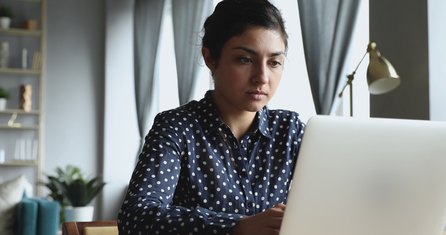 Young indian woman using looking at laptop computer at home office frustrated shocked after reading bad online news got email with failed test exam results feel upset stressed having problem concept Royalty-Free Stock Footage #1037339312