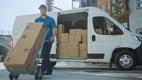 Courier Opens Delivery Van Side Door and Takes out Cardboard Box Package, Closes the Door and Goes on Delivering Postal Parcel. Shot on RED EPIC-W 8K