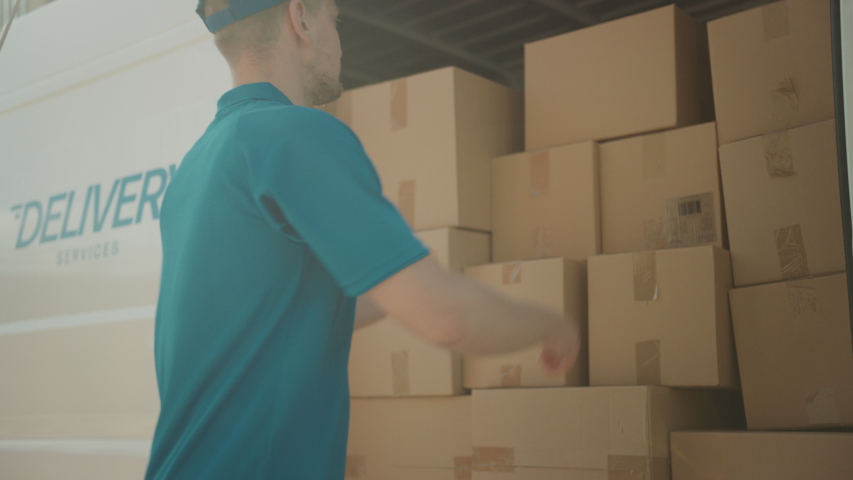 Courier Opens Delivery Van Side Door and Takes out Cardboard Box Package, Closes the Door and Goes on Delivering Postal Parcel. Slow Motion | Shutterstock HD Video #1037351351