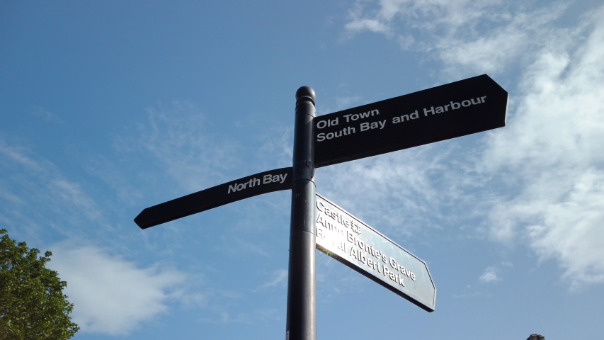 Scarborough signpost to North Bay, Castle, South Bay, and Anne Bronte