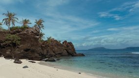 Stock footage 4k: Deserted Island, Uninhabited island. Royalty high-quality stock video footage of desert island with palm tree or coconut trees on the beach, tropical beach with clear turquoise water