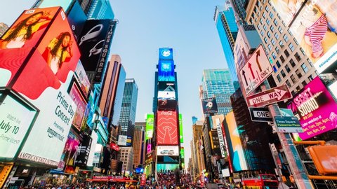 Times Square New York City Sunset Timelapse. High dynamic range 4K super fine timelapse by raw photo files. Crazy busy people, traffic and LED walls of advertisements. 
New York, USA. July 9, 2019

