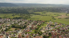 Aerial view of the city Mahlberg in Germany on a sunny day in summer. Wide view with round pan to the right.