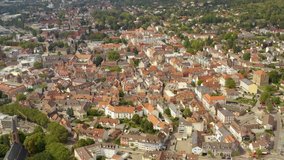 Aerial view of the town Lahr in Germany  on a sunny day in summer. Zoom in with tilt down on the town.