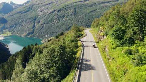 Motorcycle rides on the road in Geirangerfjord Norway.
