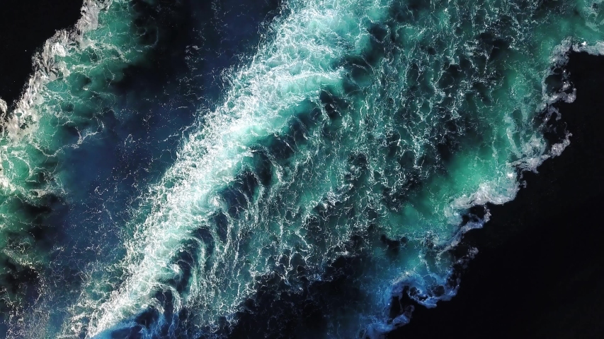 Beautiful trail on the sea surface behind the cruise ship. Aerial top down view of water foam trace behind the speedboat. Her engine roaring at full speed leaving wake water on the sea
 Royalty-Free Stock Footage #1037378702