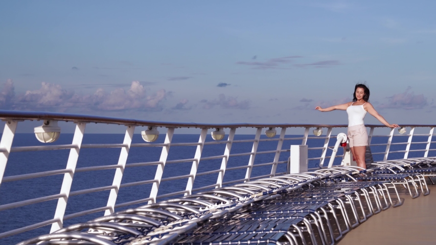 Woman enjoys sunset on a cruise ship
 | Shutterstock HD Video #1037383259