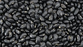 Raw Black beans seed food organic top view texture ,Rich in calcium, which helps maintain bones and teeth, supplementary food, Protein healthy food, video footage.
