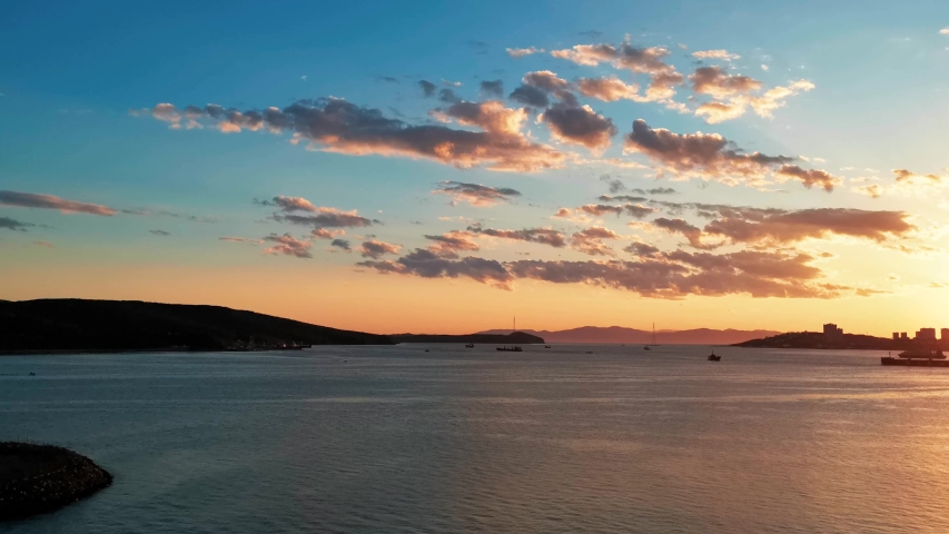 Seascape with beautiful sunset and city views. Vladivostok, Russia