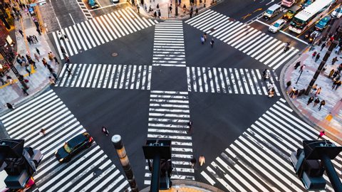 Time lapse People passing the street crossing in Ginza district, Tokyo. Crosswalk. Intersection in Tokyo,Japan