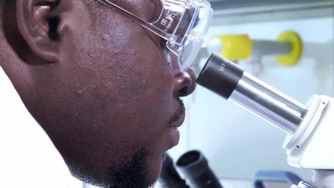 African-american scientist working in lab. Doctor making microbiology research. Biotechnology, chemistry, bacteriology, virology, dna and health care. Video stock