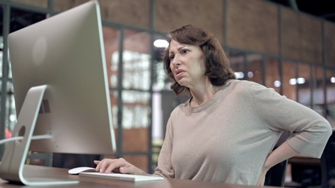 Back Pain, Uncomfortable Old Woman Working on Computer