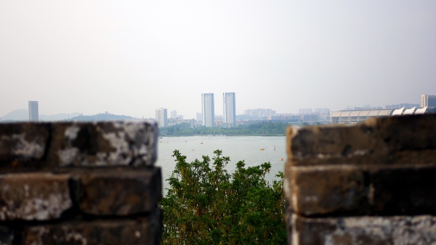 view of lake and building from ancient defense wall in Nanjing china