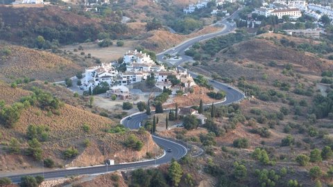 Road with vehicles circulating from the city of Fuengirola to the town of Mijas.