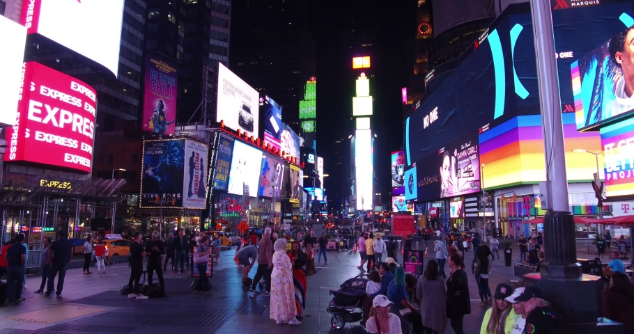 New York , New York / United States - 06 10 2019: People on the Times Square at night in New York City.