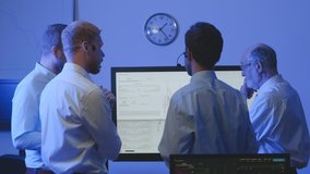Stock traders looking at graphs, indexes and numbers on computer screen. Successful business team. - Powered by Shutterstock - Get 15% off with code: PIKWIZARD15