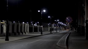 Empty urban street, night scenery in the city with street lamps on black sky background. Stock footage. Late evening road in modern residential area. - Powered by Shutterstock - Get 15% off with code: PIKWIZARD15