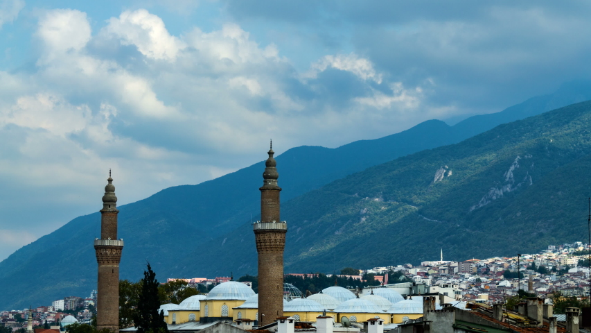 Bursa Ulu Cami Mosque minaret and Uludag Mountain view. Time lapse video