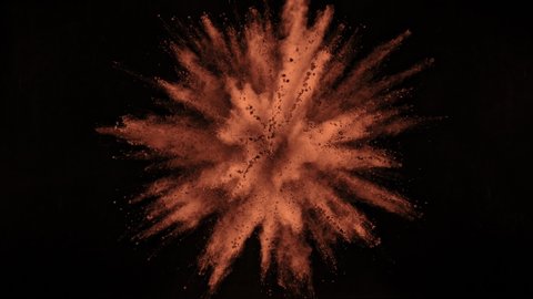 Super Slow Motion Shot of Cocoa Powder Explosion Isolated on Black Background at 1000fps.