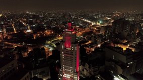 Santander' Lighthouse in São Paulo.  Famos tourism point. Aerial view of a  building illuminated with red color  exactaly in the center of São Paulo, Brazil. Gret landscape. Cityscape view.