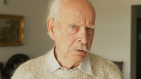 Closeup portrait, senior mature man, looking shocked, scared trying to protect himself in anticipation of unpleasant situation.  