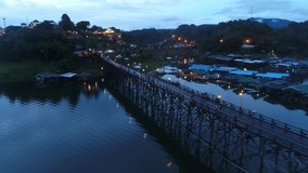 4k Aerial Drone Video over The old wooden bridge (Mon bridge) at Sangkhlaburi, Kanchanaburi thailand. sunset wooden bridge Province Asia thailand	
