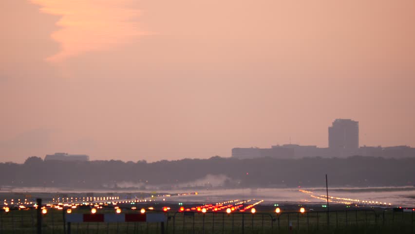 4K Airplane landing at dusk Royalty-Free Stock Footage #10374956