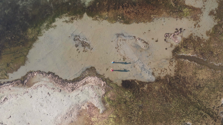 Aerial view fishermans fishing on a pond near to the sea , Etang de Thau in Sete, south of france, french lake