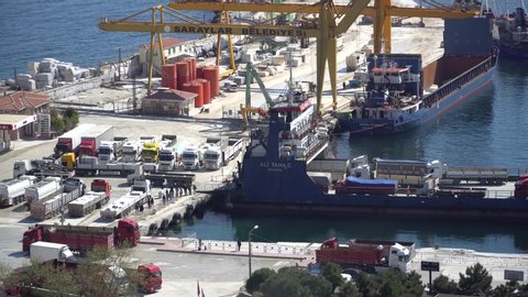 Marmara island - Turkey - April 2019: Ferryboat unloading trucks and cars at the Marmara island harbour