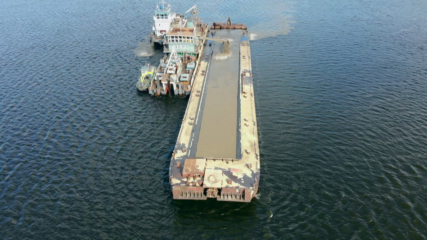 Sand extraction machines working on water.