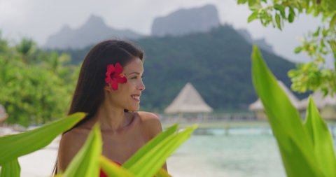 Woman wellness spa skincare Asian natural beauty on tropical beach in French Polynesia, Bora Bora, Tahiti. Shot on RED in SLOW MOTION.