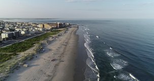 Aerial view drone video of New Jersey beach in afternoon sunset Wildwood