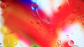 Colorful artistic image of oil drop floating on the water 