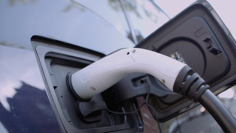 Electric Car Socket Pulls into Focus Whilst Charging an Environmentally Friendly Car