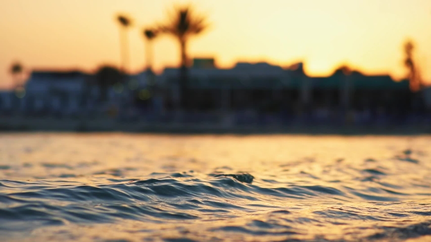 Closeup view of sea waves in summer twilight at sunset light. Happy vacations, the end of holidays abroad. Amazing tropical nature. Magic beauty of water. Ecology and environmental protection. | Shutterstock HD Video #1037544209