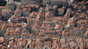 Dubrovnik, Croatia. View of old city roofs, streets, houses and walls. Panoramic view of the historic city. Famous tourist destination on Adriatic sea. UNESCO world heritage site.