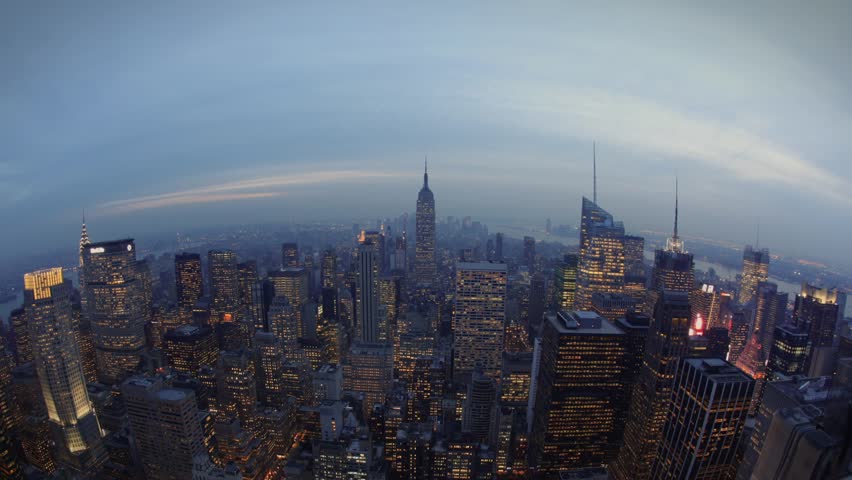 time-lapse fish-eye view, the  sun sets over the skyline, New York City, USA.