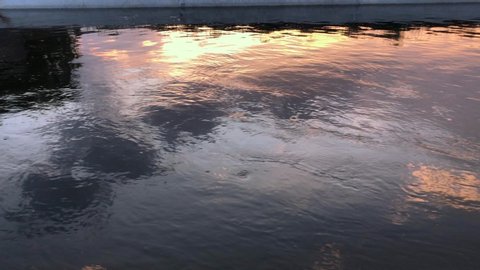Moving surface water in the sunset time. Slow motion