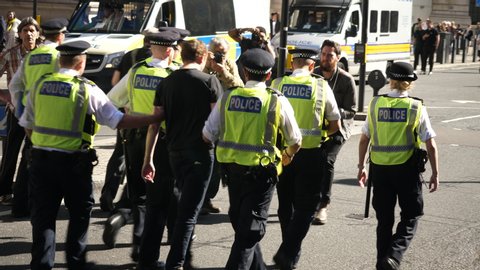 LONDON, UK - 20 SEP 2019; Police Officers Arrest calm protester activist at Climate March