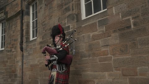 EDINBURGH / SCOTLAND - JULY 24, 2019: Traditional Scottish hornpipe player in costume in Edinburgh